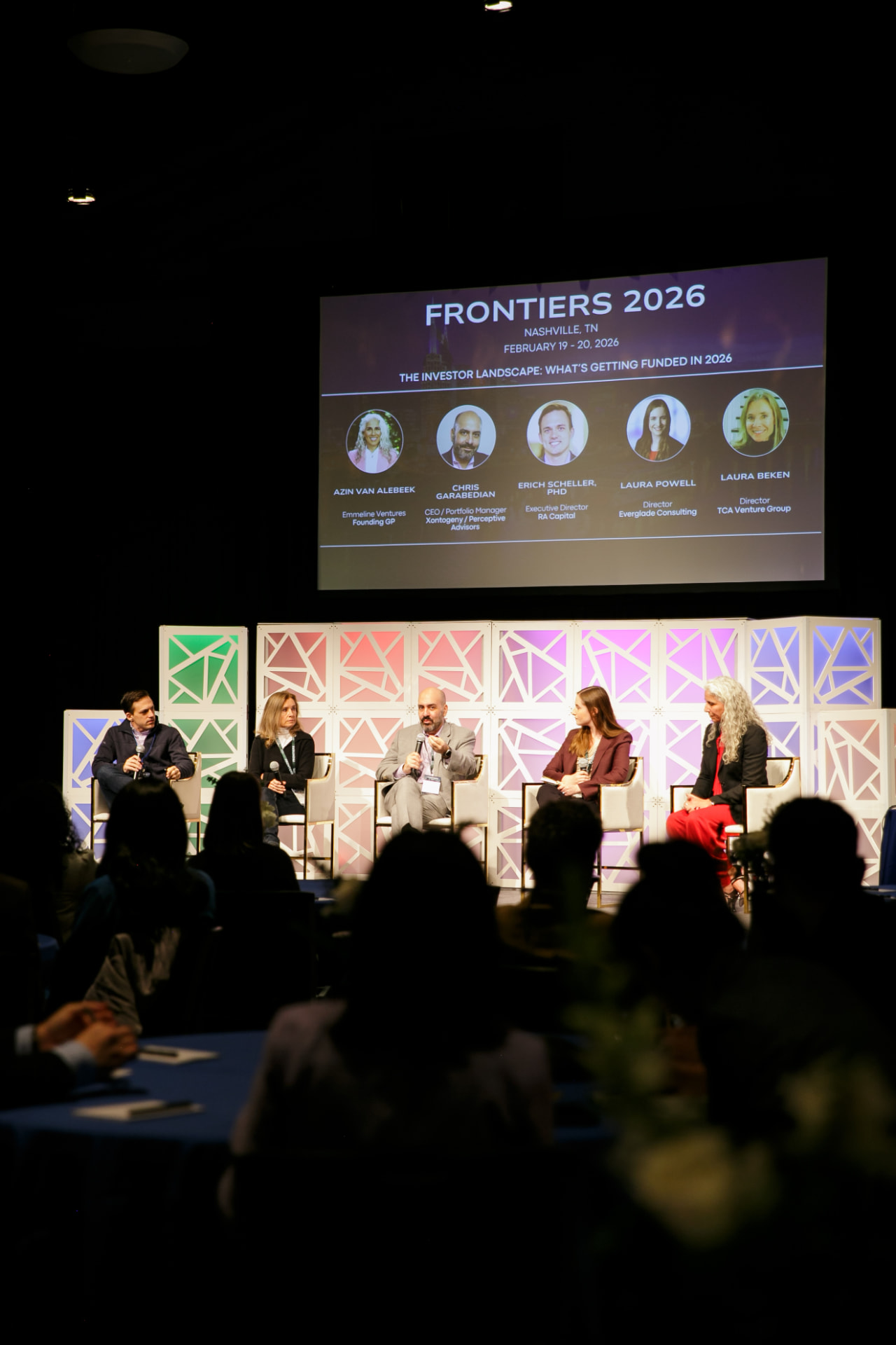 A panel discussion on stage at the Frontiers Summit